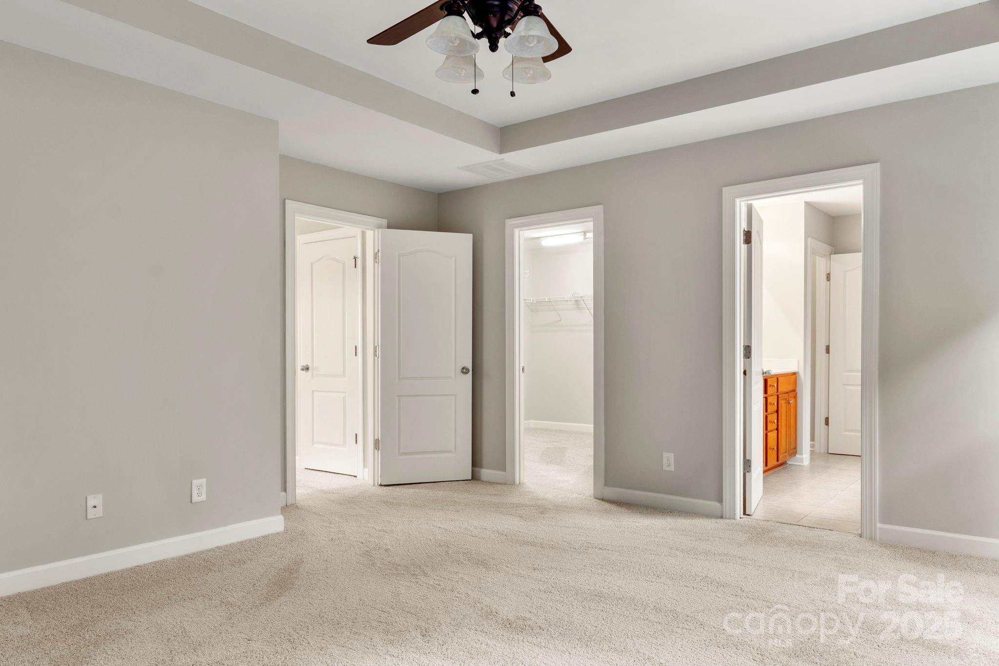 6927 Maricopa Road Charlotte, NC 28277 - Photo 25 of 32 an empty room with fan and entrance