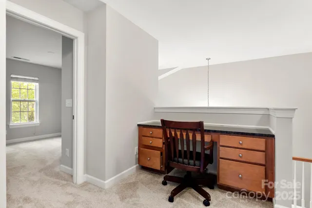 a room with furniture and a dresser