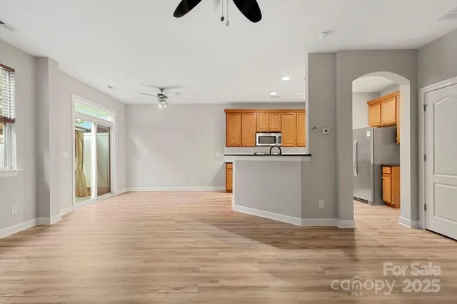 a view of a kitchen with a sink and cabinets