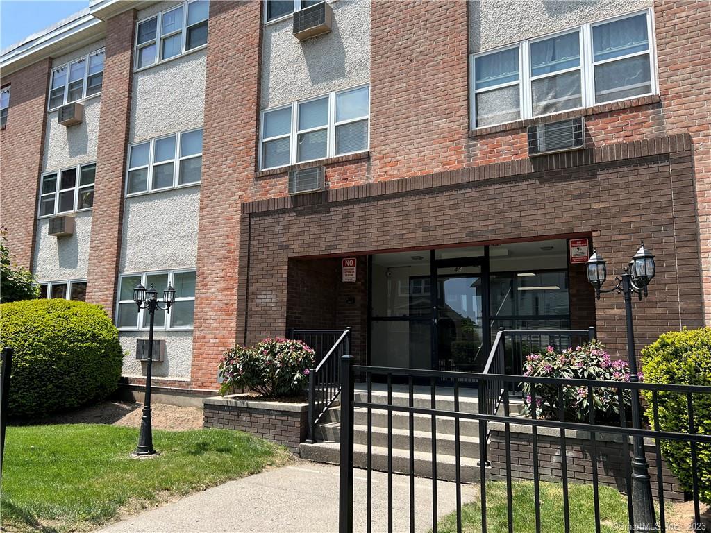 45 Monroe Street, Unit C6 Bridgeport, CT 06605 - Photo 2 of 11 a front view of a house with a yard