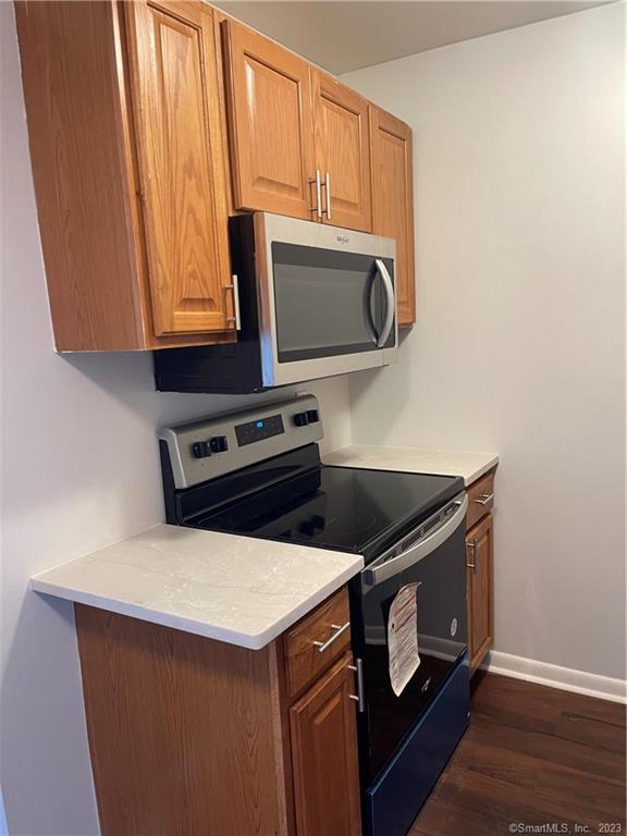45 Monroe Street, Unit C6 Bridgeport, CT 06605 - Photo 7 of 11 a stove top oven sitting inside of a kitchen
