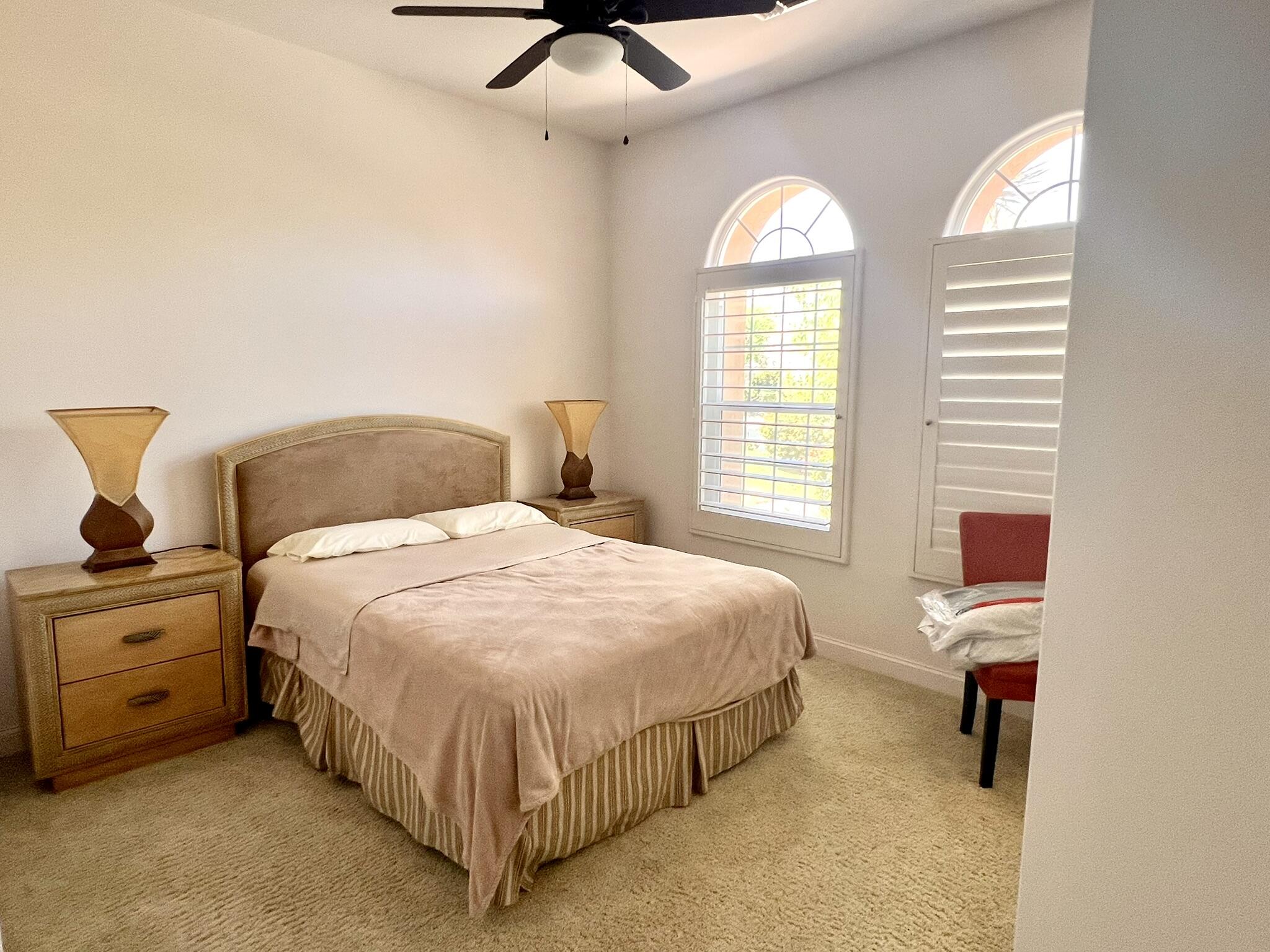 18 Vía Bella Rancho Mirage, CA 92270 - Photo 2 of 15 a bedroom with a bed and a window
