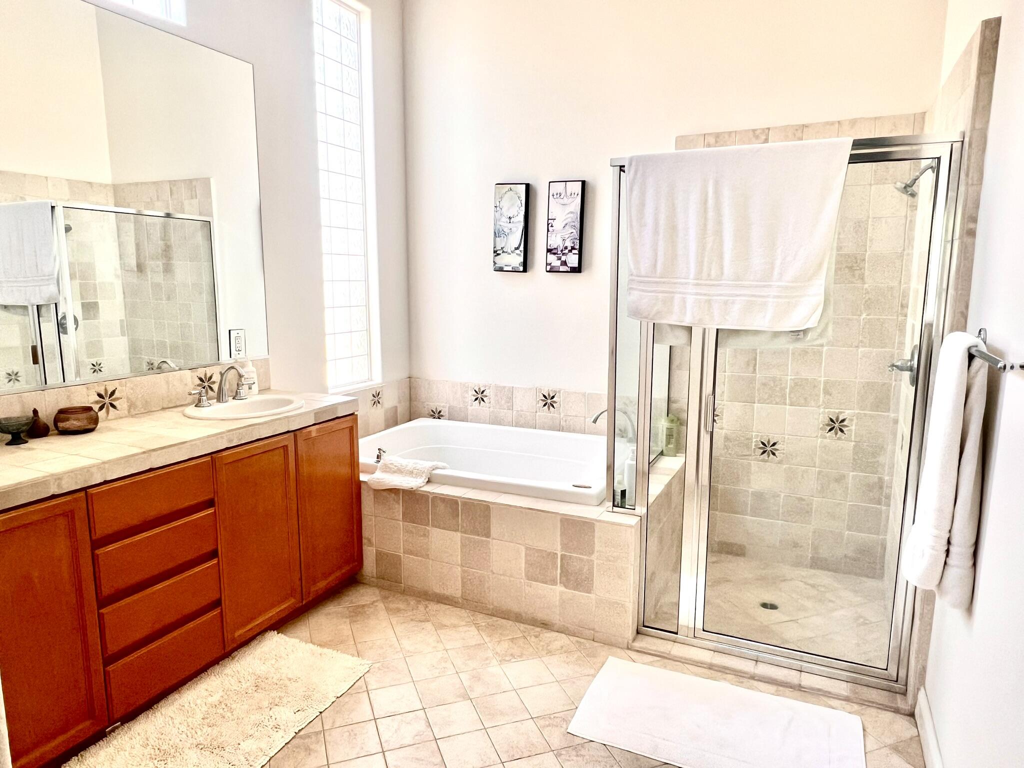 18 Vía Bella Rancho Mirage, CA 92270 - Photo 4 of 15 a spacious bathroom with a tub sink and shower