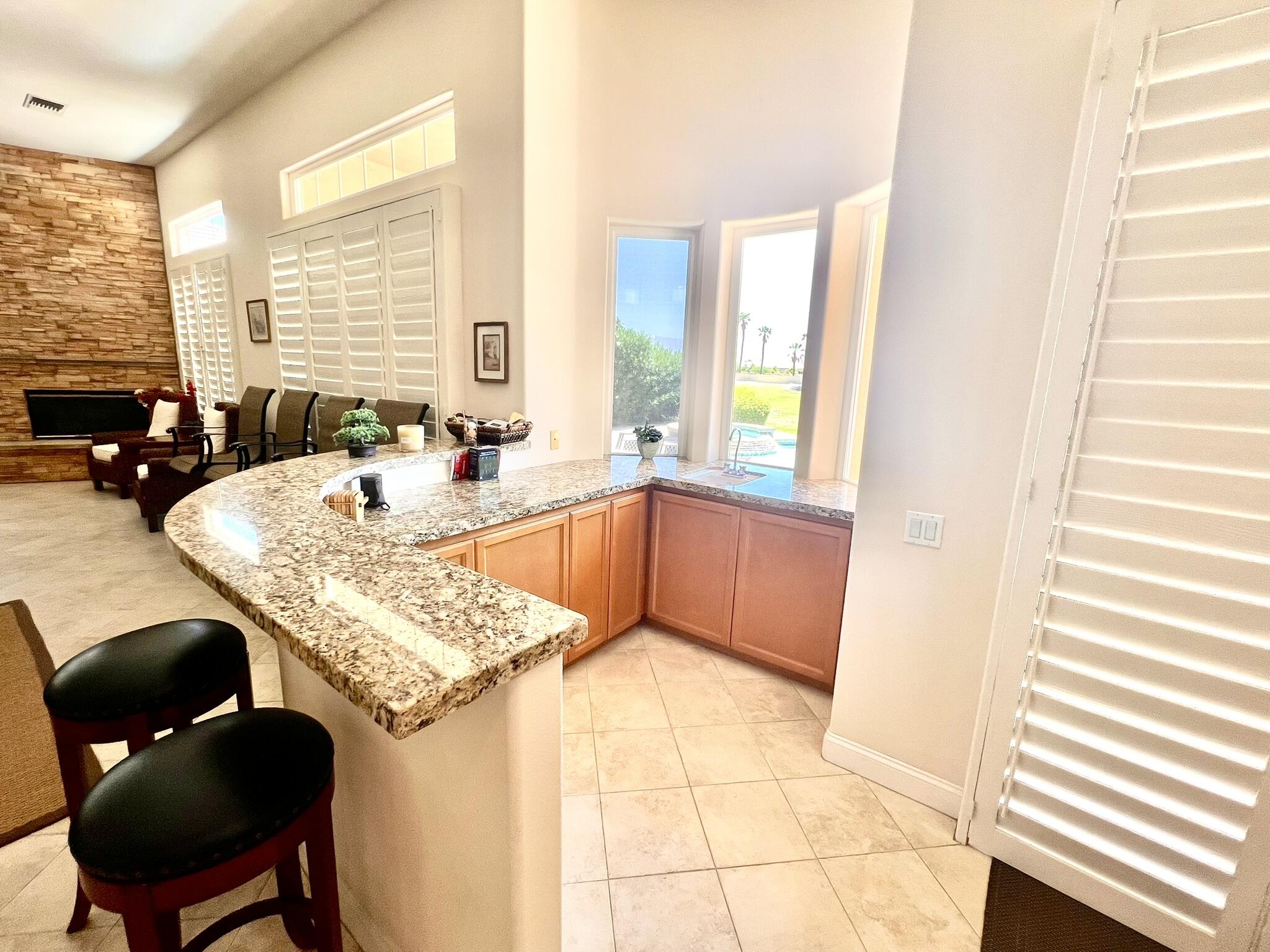 18 Vía Bella Rancho Mirage, CA 92270 - Photo 7 of 15 a dining table with chairs and window