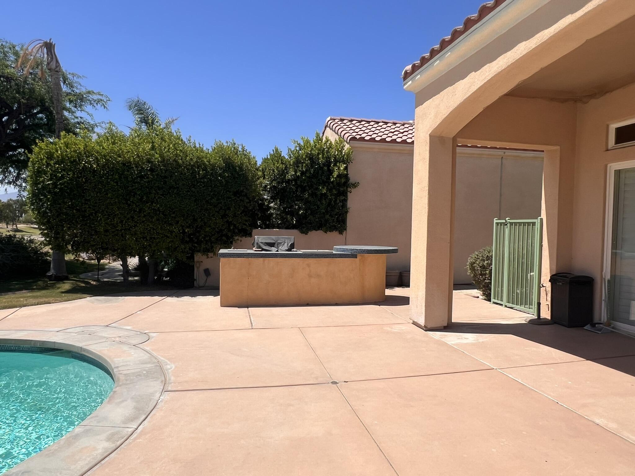 18 Vía Bella Rancho Mirage, CA 92270 - Photo 9 of 15 a view of swimming pool with a lounge chairs