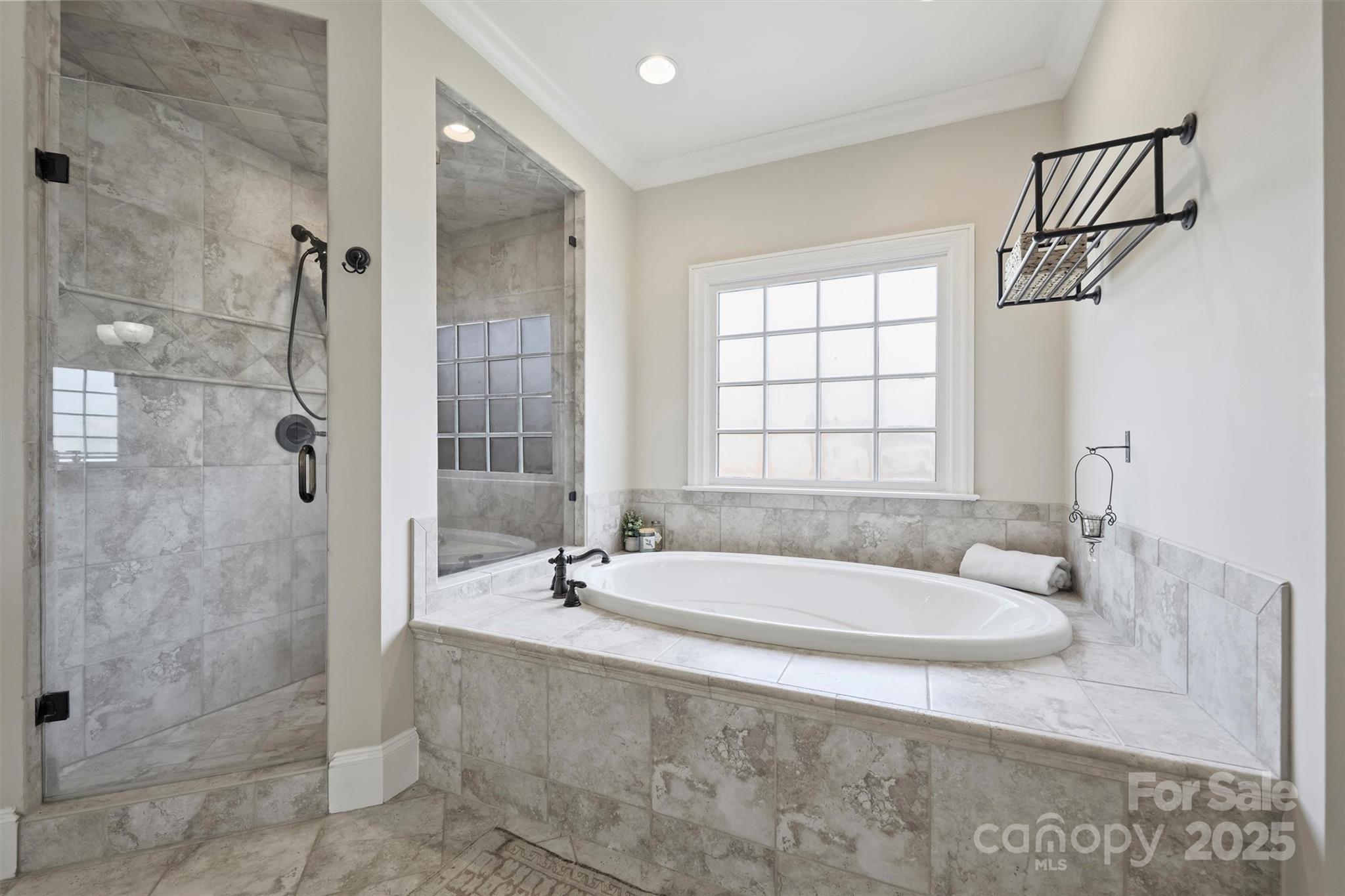 5827 Riley's Ridge Road Charlotte, NC 28226 - Photo 30 of 48 a spacious bathroom with a tub shower and window