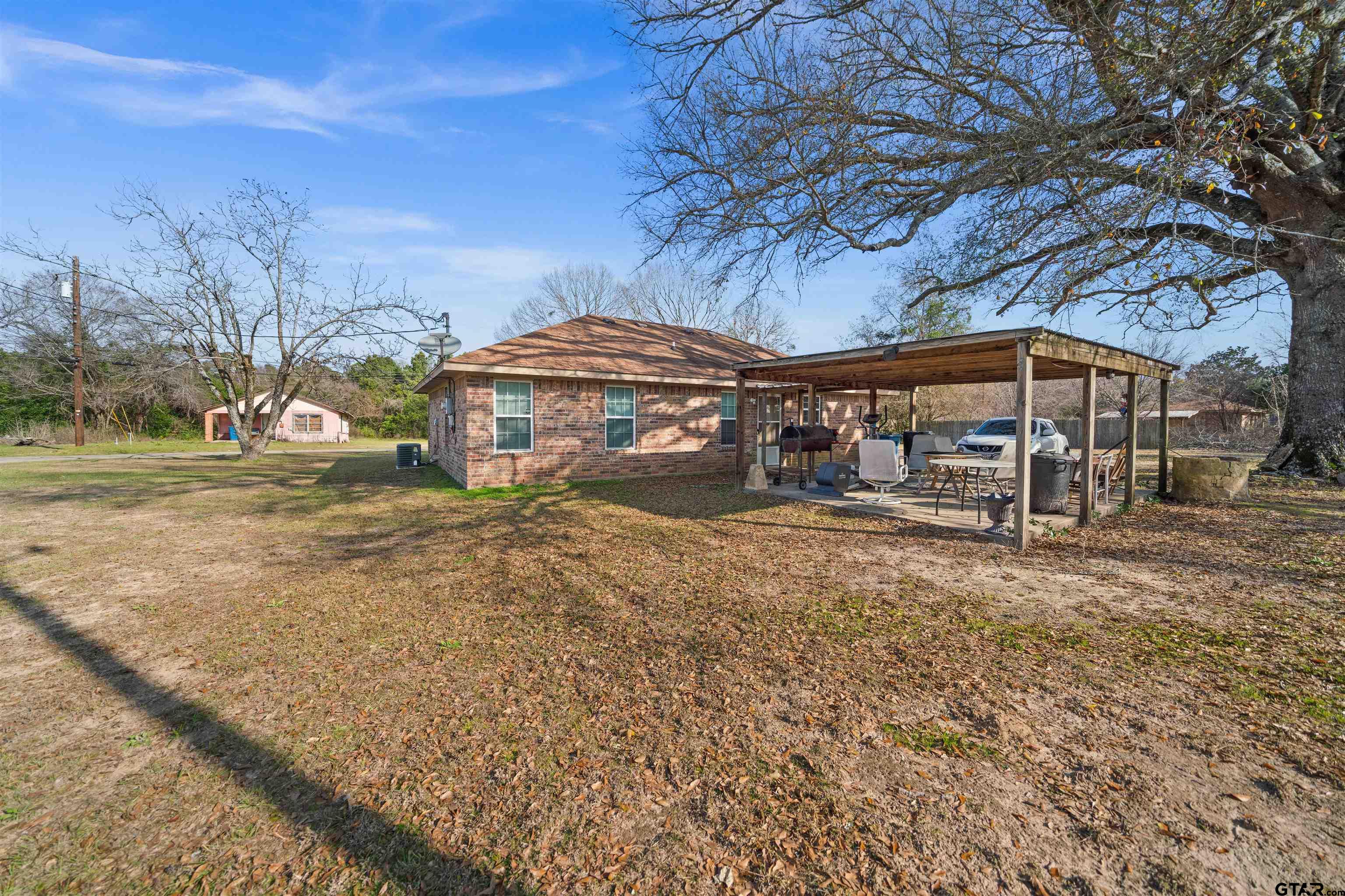 803 Sims Avenue Jacksonville, TX 75766 - Photo 20 of 23 a view of a house with a yard