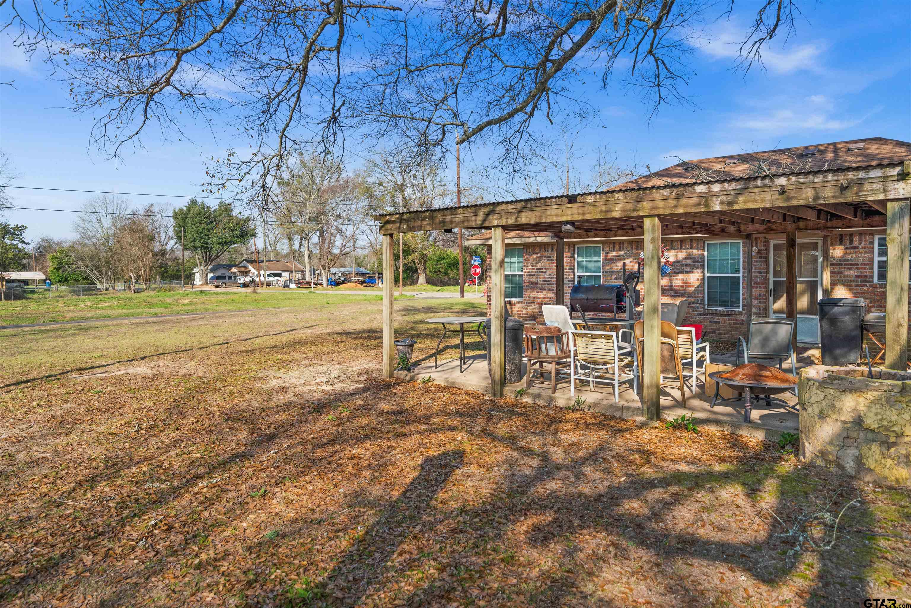 803 Sims Avenue Jacksonville, TX 75766 - Photo 22 of 23 a view of a chairs and table in the patio