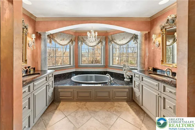 a kitchen with a sink a stove and cabinets