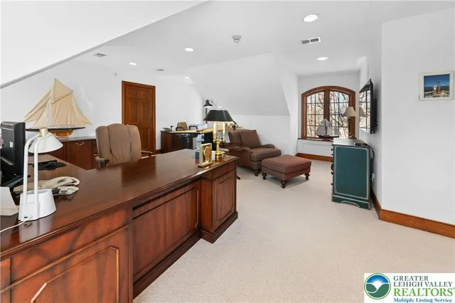 a living room with furniture window and wooden floor