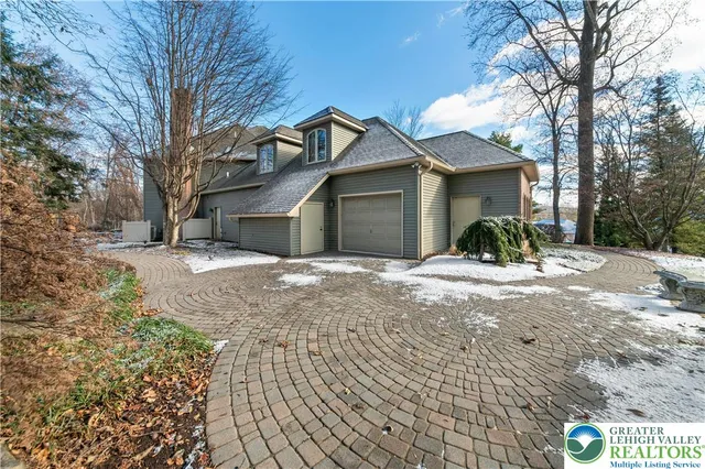 a view of a backyard with large trees