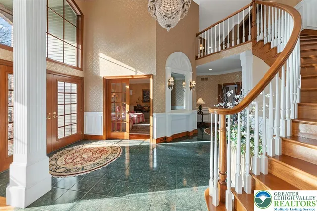 a view of entryway livingroom and hall with wooden floor