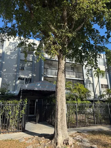 a room with a bed and large window