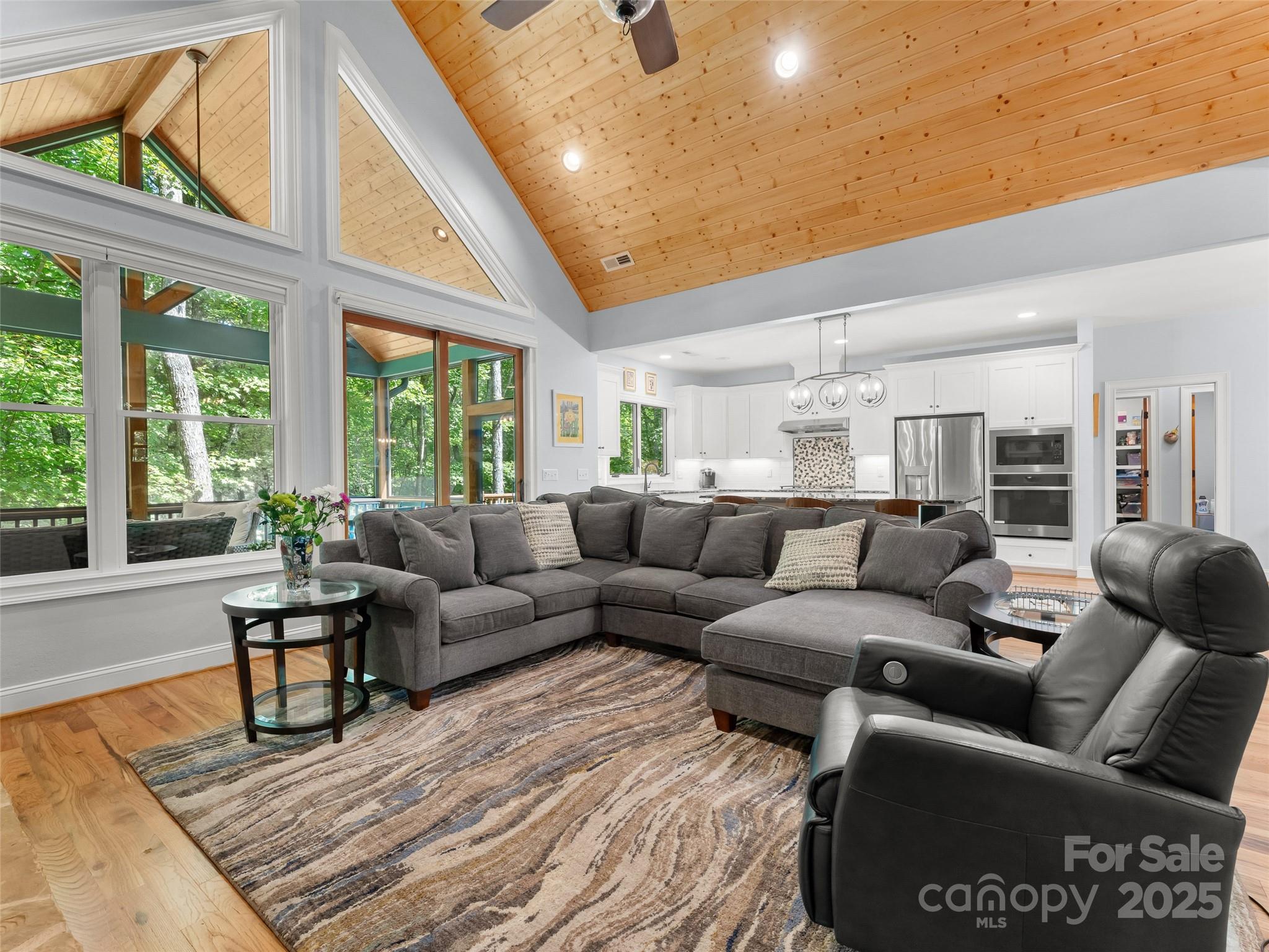 249 Tsisqua Circle Brevard, NC 28712 - Photo 13 of 39 a living room with furniture and a large window