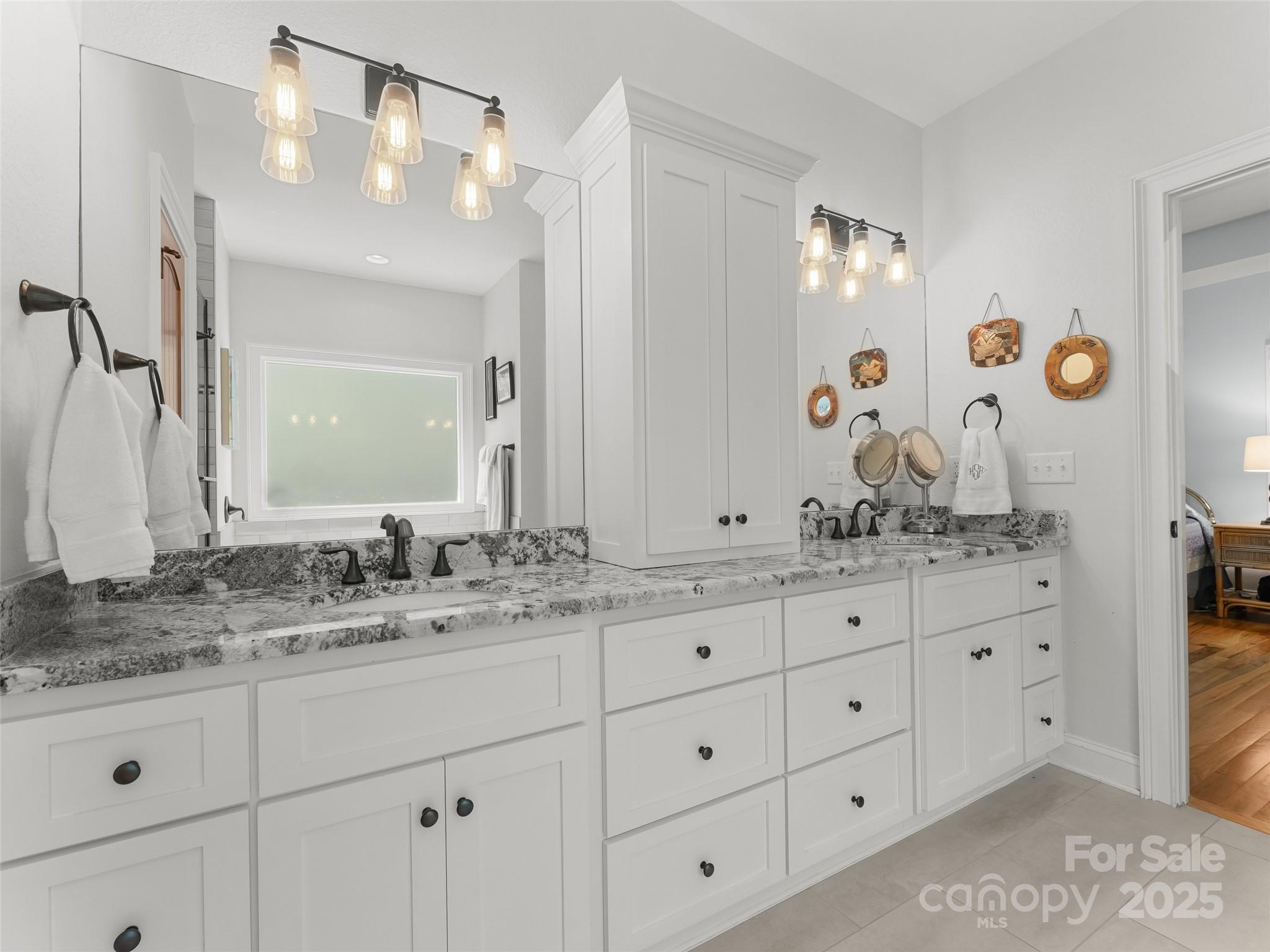 249 Tsisqua Circle Brevard, NC 28712 - Photo 29 of 39 a bathroom with a granite countertop sink vanity mirror and