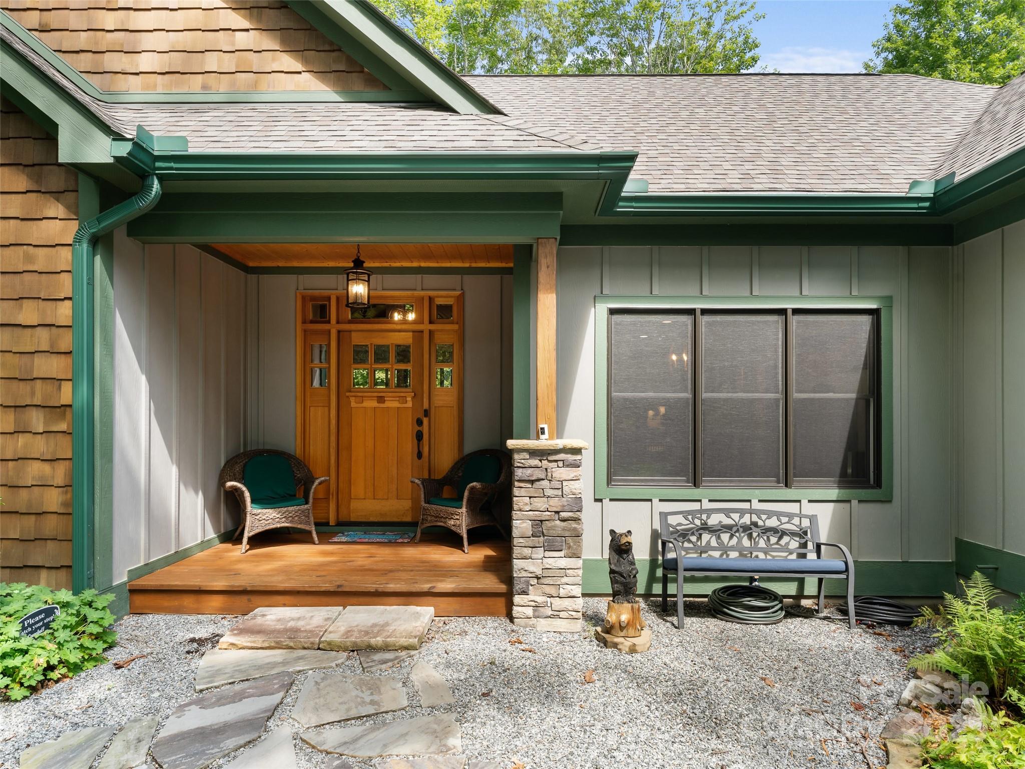 249 Tsisqua Circle Brevard, NC 28712 - Photo 3 of 39 a front view of a house with garden