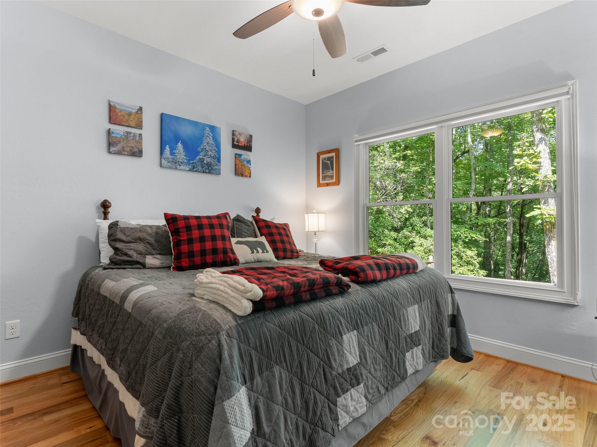 249 Tsisqua Circle Brevard, NC 28712 - Photo 31 of 39 a bedroom with a bed and window