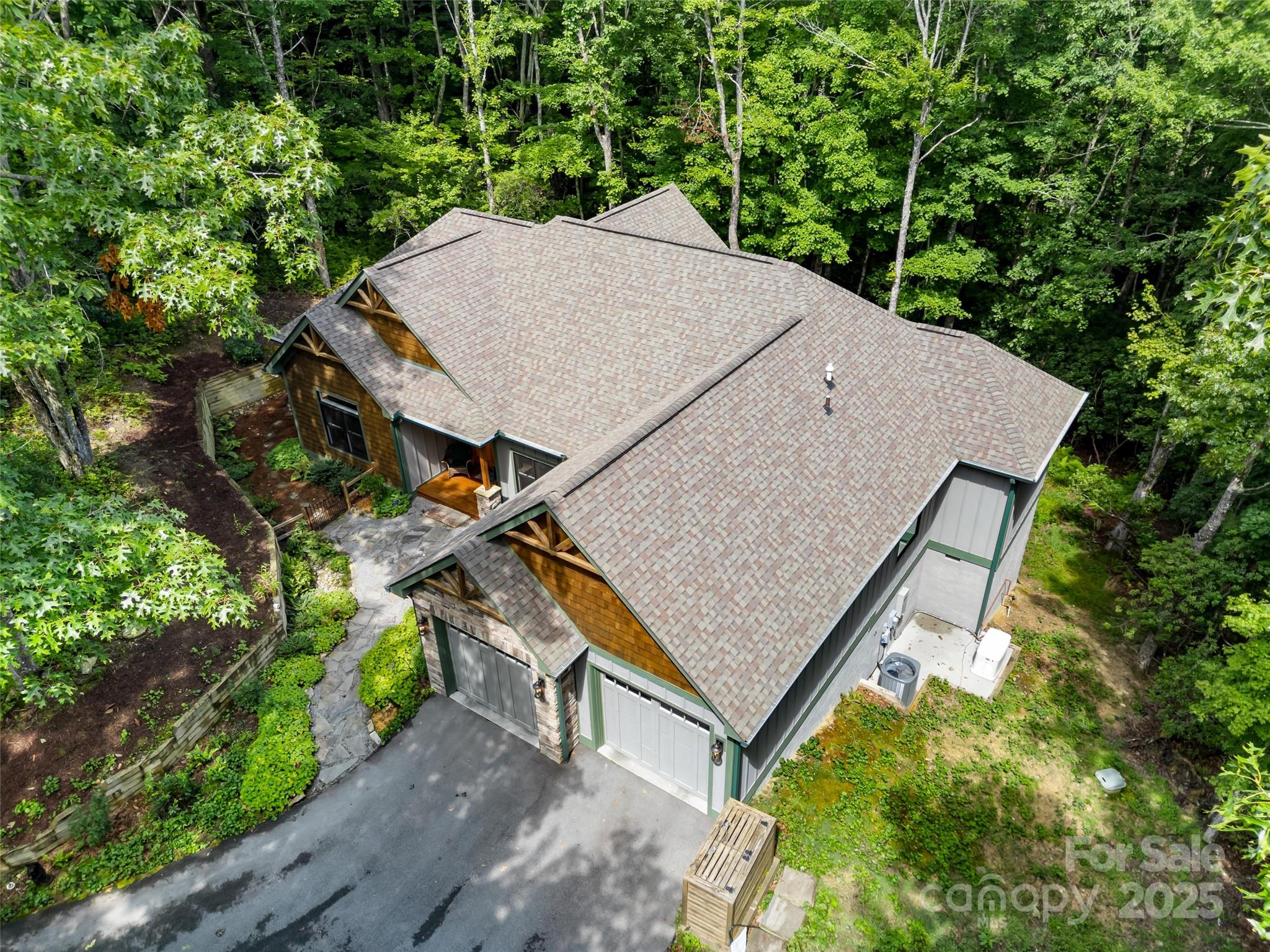 249 Tsisqua Circle Brevard, NC 28712 - Photo 4 of 39 an aerial view of a house with yard and trampoline
