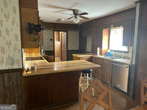 a room with table chairs and window