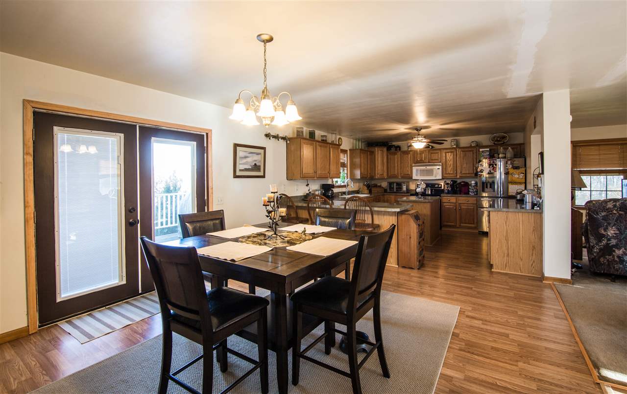 5919 Goods Mill Road Harrisonburg, VA 22801 - Photo 7 of 24 a view of a dining room and livingroom with furniture wooden floor a chandelier