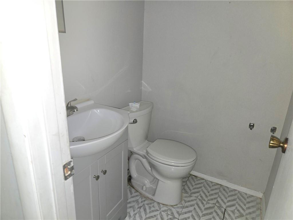 4701 Flat Shoals Road, Unit 67D Union City, GA 30291 - Photo 10 of 13 a white toilet sitting next to a white sink