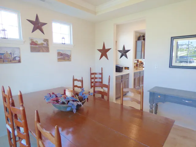 a view of a livingroom with furniture and a table