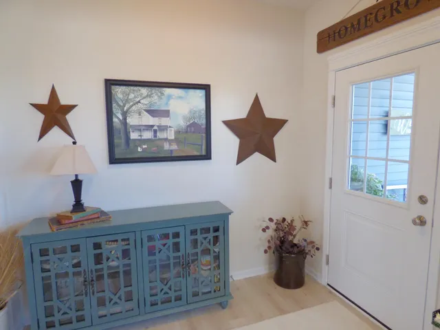 a view of a hallway with paintings on the wall