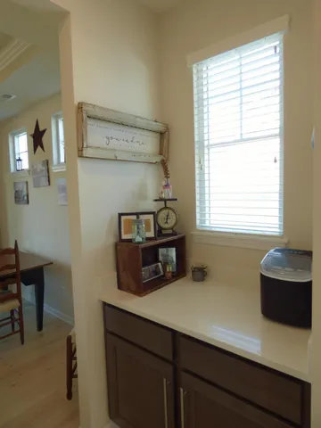 a kitchen with a cabinets and window