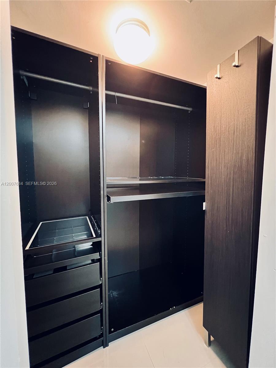 41 Southeast 5th Street, Unit 703 Miami, FL 33131 - Photo 8 of 18 a close view of walk in closet