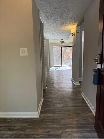a view of livingroom with hardwood floor and hallway