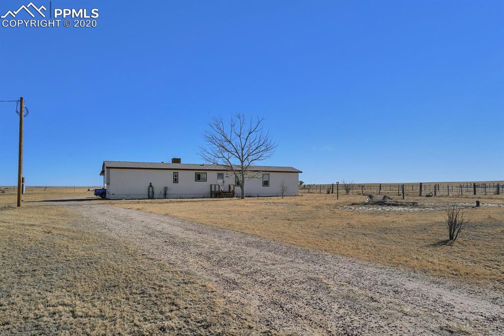 4685 Yoder Road Yoder, CO 80864 - Photo 2 of 32 Covered single car parking as well as tons of additional parking.