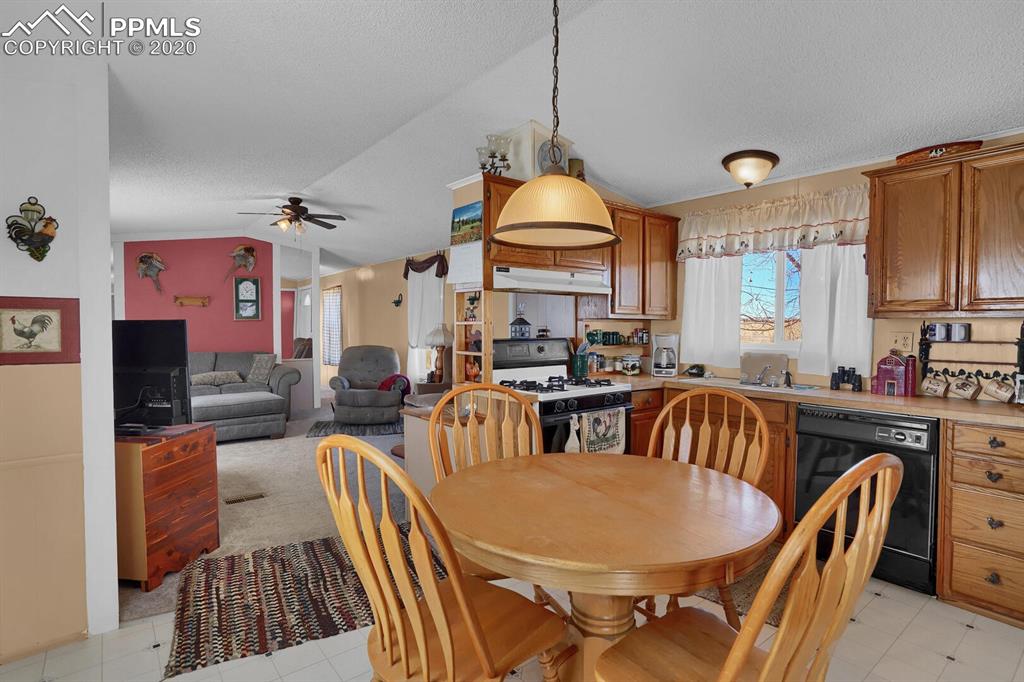 4685 Yoder Road Yoder, CO 80864 - Photo 12 of 32 Kitchen opens up to the living room.