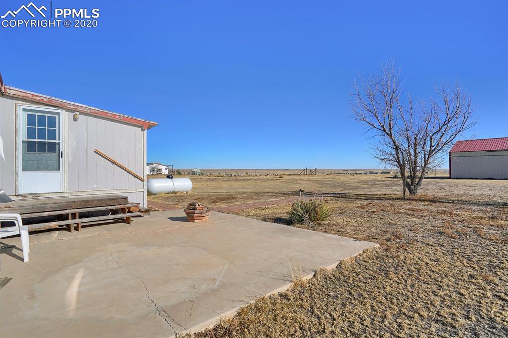 4685 Yoder Road Yoder, CO 80864 - Photo 24 of 32 Back patio overlooks this beautiful property.