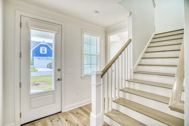 a view of an entryway with wooden floor