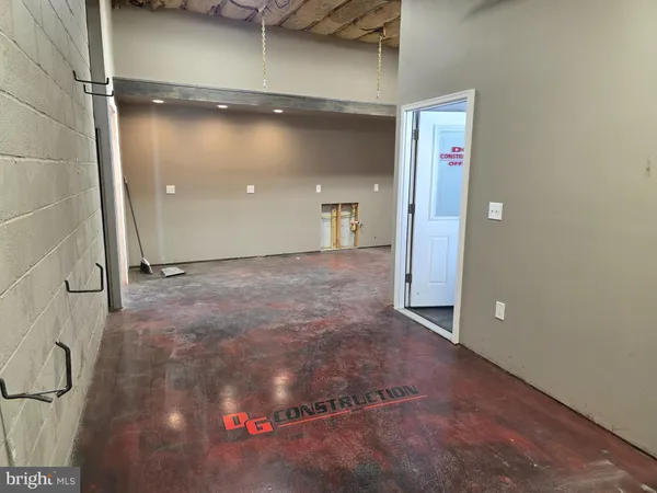 a room with a table and windows