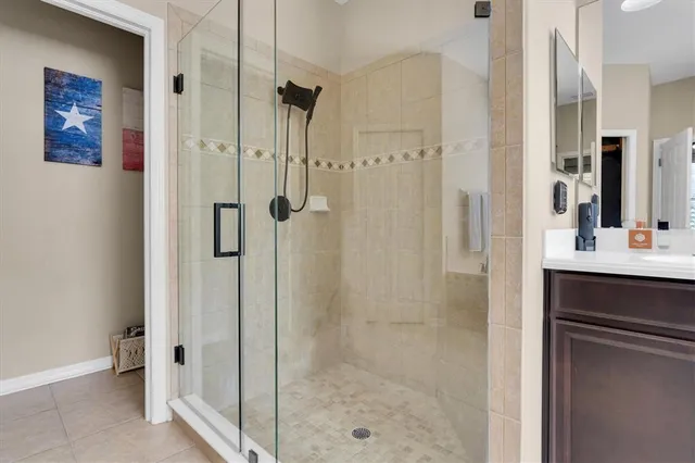 a bathroom with a shower and a sink