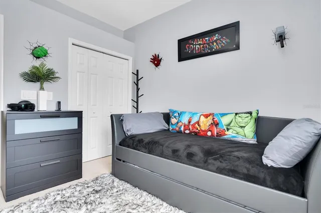 a living room with furniture flowerpot and a potted plant