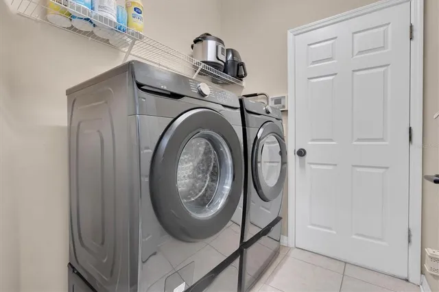 a view of storage and utility room with washer and dryer