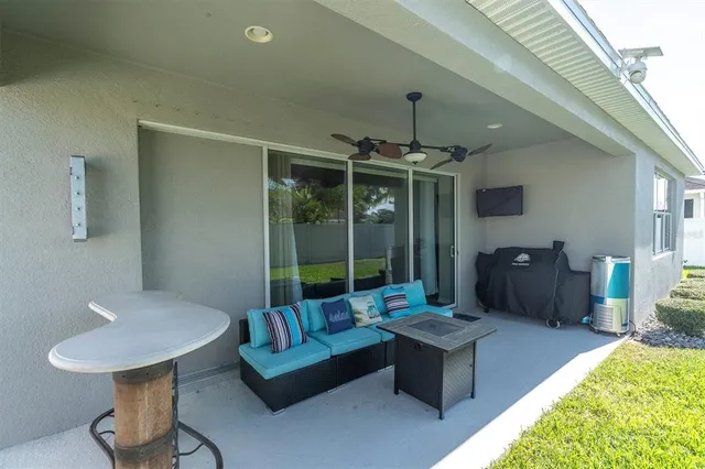 a living room with furniture and a large window