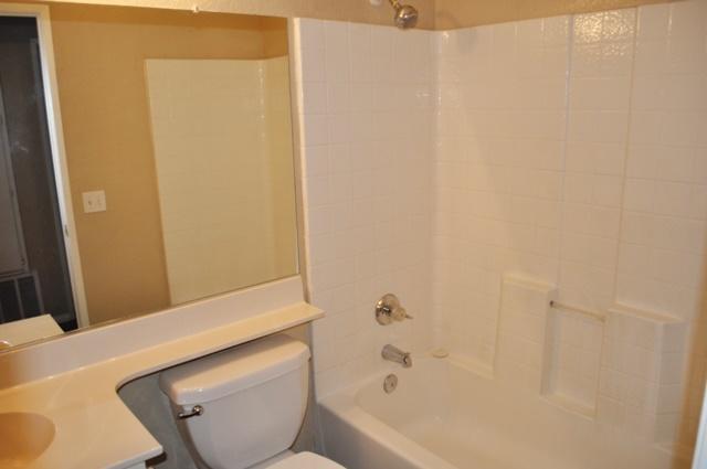 3153 Quarry Road Palmdale, CA 93550 - Photo 15 of 21 a bathroom with a toilet and bathtub