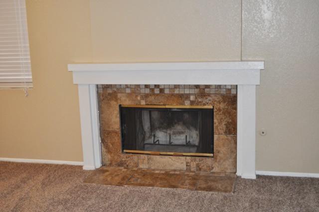 3153 Quarry Road Palmdale, CA 93550 - Photo 3 of 21 a living room with a fireplace