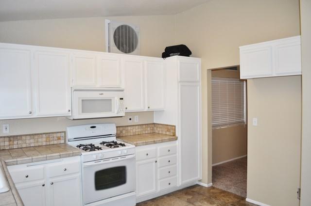 3153 Quarry Road Palmdale, CA 93550 - Photo 6 of 21 a kitchen with cabinets and appliances