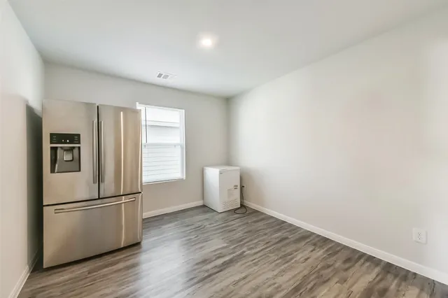 a kitchen with a refrigerator a sink and dishwasher