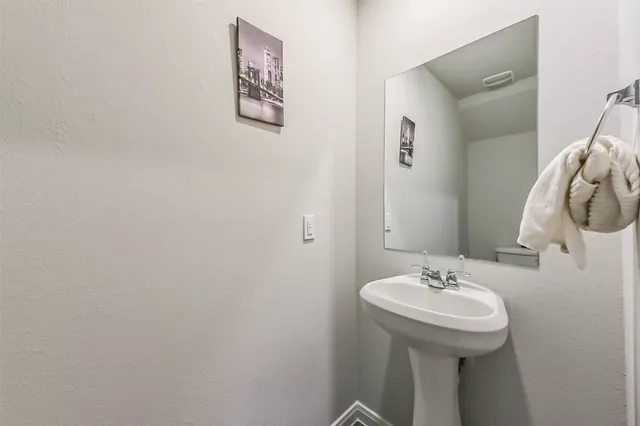 a bathroom with a sink and mirror