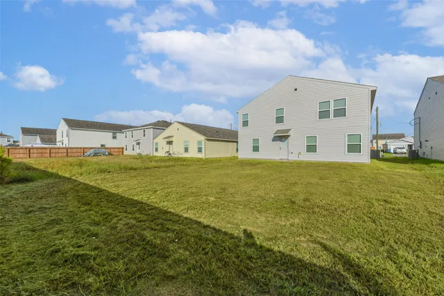 a view of a big house with a big yard