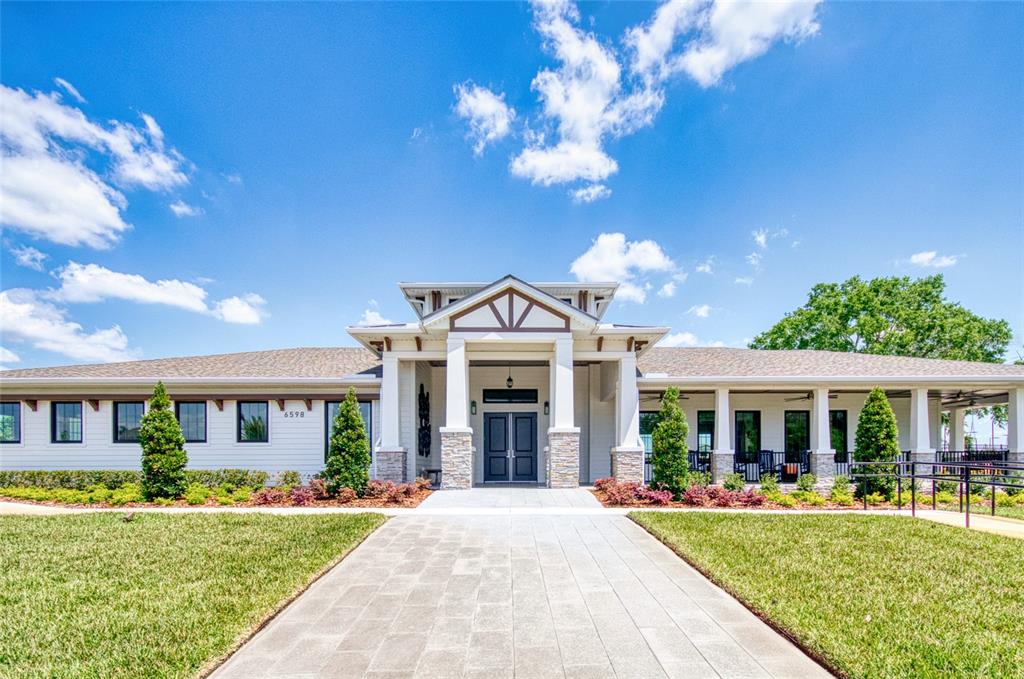 6736 Ripple Pond Loop Zephyrhills, FL 33541 - Photo 27 of 40 a front view of a house with a yard