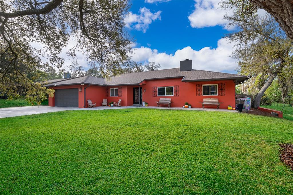 2350 Wekiva Ridge Road Apopka, FL 32712 - Photo 1 of 34 a front view of house with yard and green space