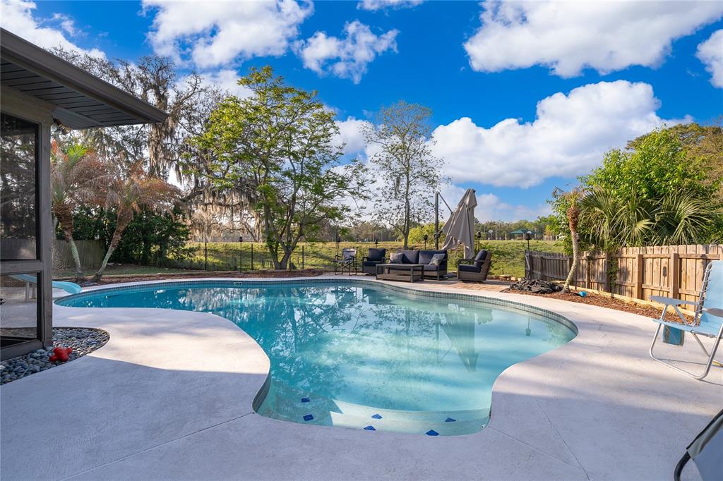 2350 Wekiva Ridge Road Apopka, FL 32712 - Photo 14 of 34 a view of a swimming pool with a patio