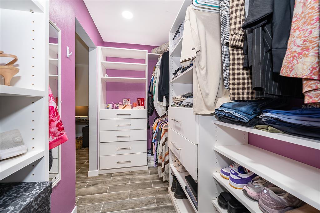 2350 Wekiva Ridge Road Apopka, FL 32712 - Photo 22 of 34 a view of walk in closet with clothes and shoes