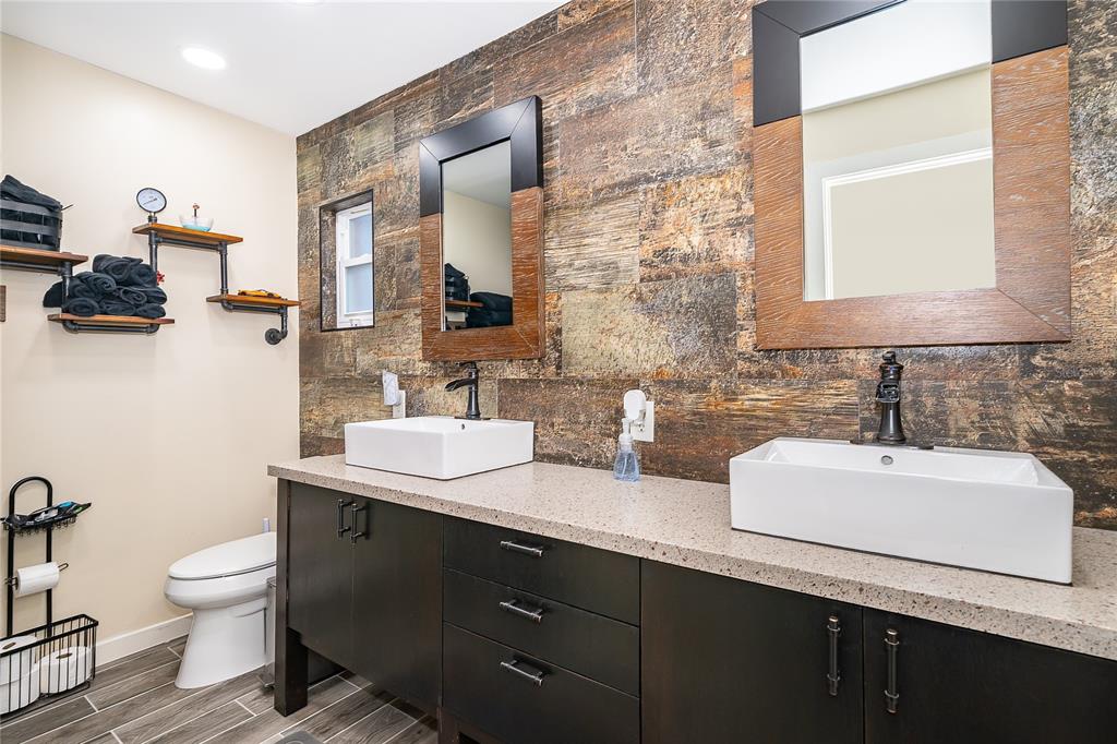 2350 Wekiva Ridge Road Apopka, FL 32712 - Photo 23 of 34 a bathroom with a toilet sink and mirror